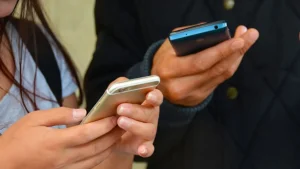 The French government announced on Monday that it will implement a ban on mobile phones in high schools