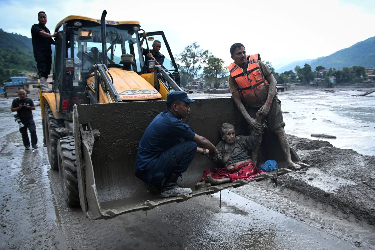 At least 165 people have been killed in Nepal and Tibet in the flash floods, with hundreds