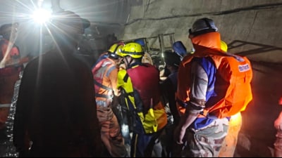 Rescuers on Tuesday recovered another body from the inundated, under-construction tunnel