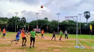 Phiball features three teams competing simultaneously on a circular court, which differs