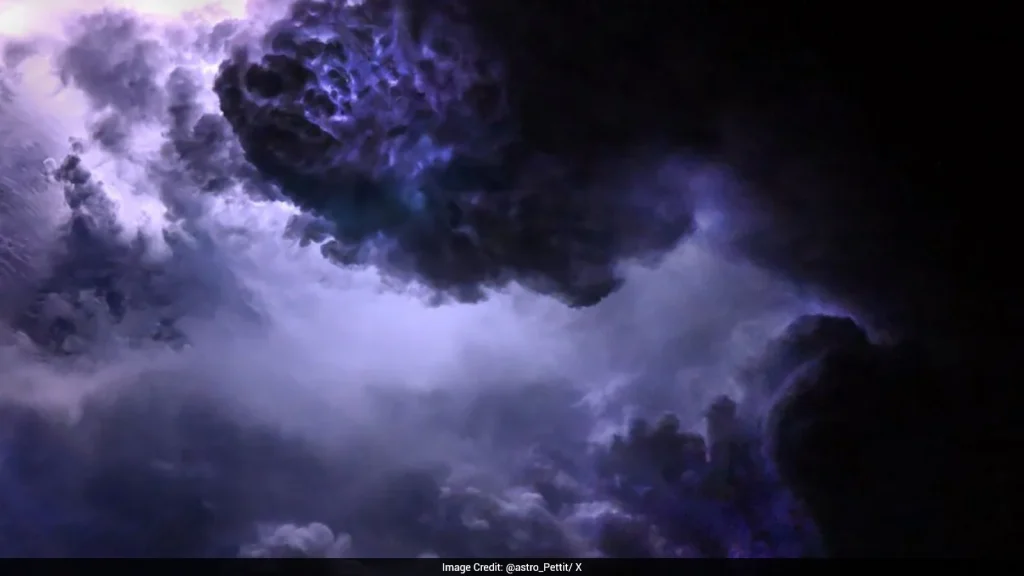 Astronaut Don Pettit has shared a view of the purple lightning flashing through clouds