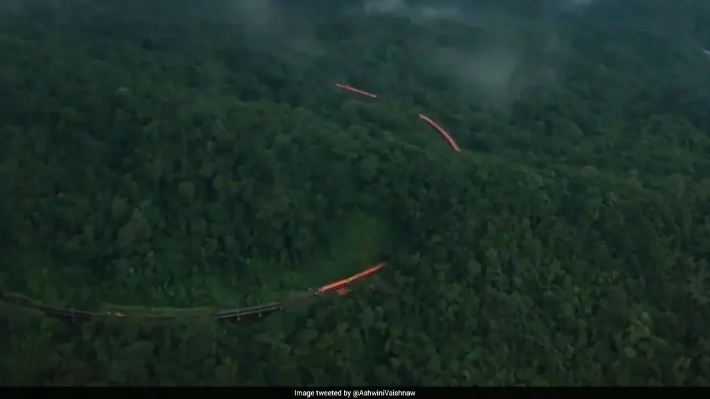 A breathtaking aerial video of the orange-and-white Vande Bharat Express winding