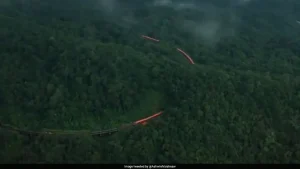 A breathtaking aerial video of the orange-and-white Vande Bharat Express winding
