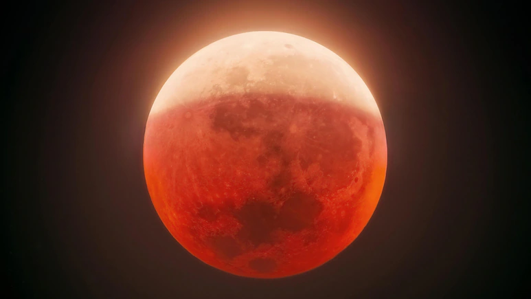 With only a thin section of the Moon remaining directly illuminated by the Sun, the eclipsed