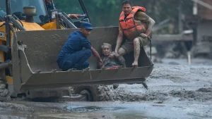 Her mud-covered clothes and the exhausted expression on her confronts speak volumes about
