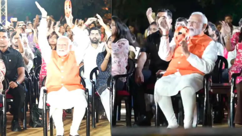 Seated on front row, PM Modi was seen clapping and playing a tambourine-like instrument