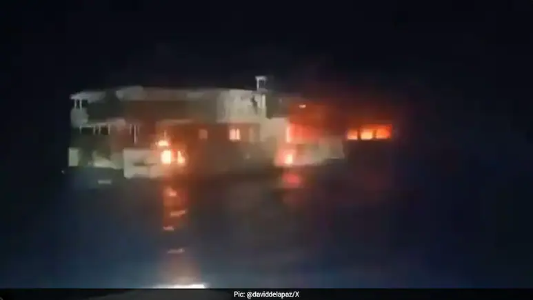 At least five people were killed and 87 remain unaccounted for after a fire erupted aboard