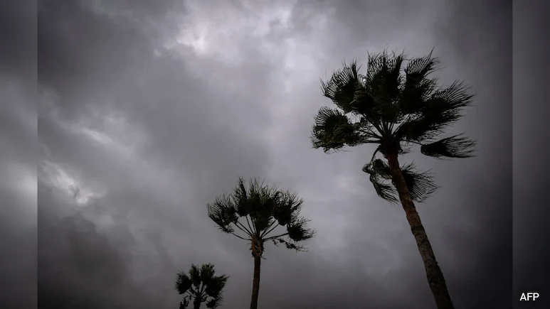 Wind whipped Mexico's northern Pacific coast and water began to flood some streets Monday as