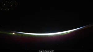 A video shared on X by Astronaut Anil Menon shows a purple aurora lighting up the night sky