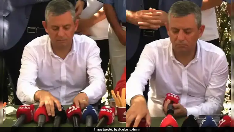 Turkish Politician Spends 47 Seconds Meticulously Arranging Mics Before Speech, Internet Amused