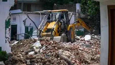 Houses of 3 accused in Banda liquor tragedy demolished — Madhya Pradesh