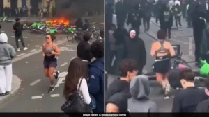 tear gas, and tense clashes, this particular clip captures a woman casually jogging as if she