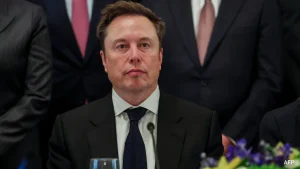 Elon Musk said Tuesday he would back a merger of SpaceX and Tesla, as his rocket and AI company