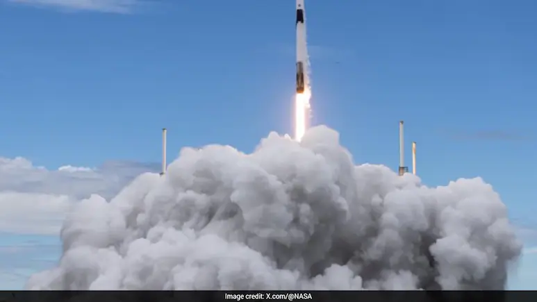 Four astronauts pulled up at the International Space Station on Thursday after launching