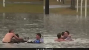 Australian Reporter And Bystander Jump Into Floodwaters To Rescue Man From Sinking Car