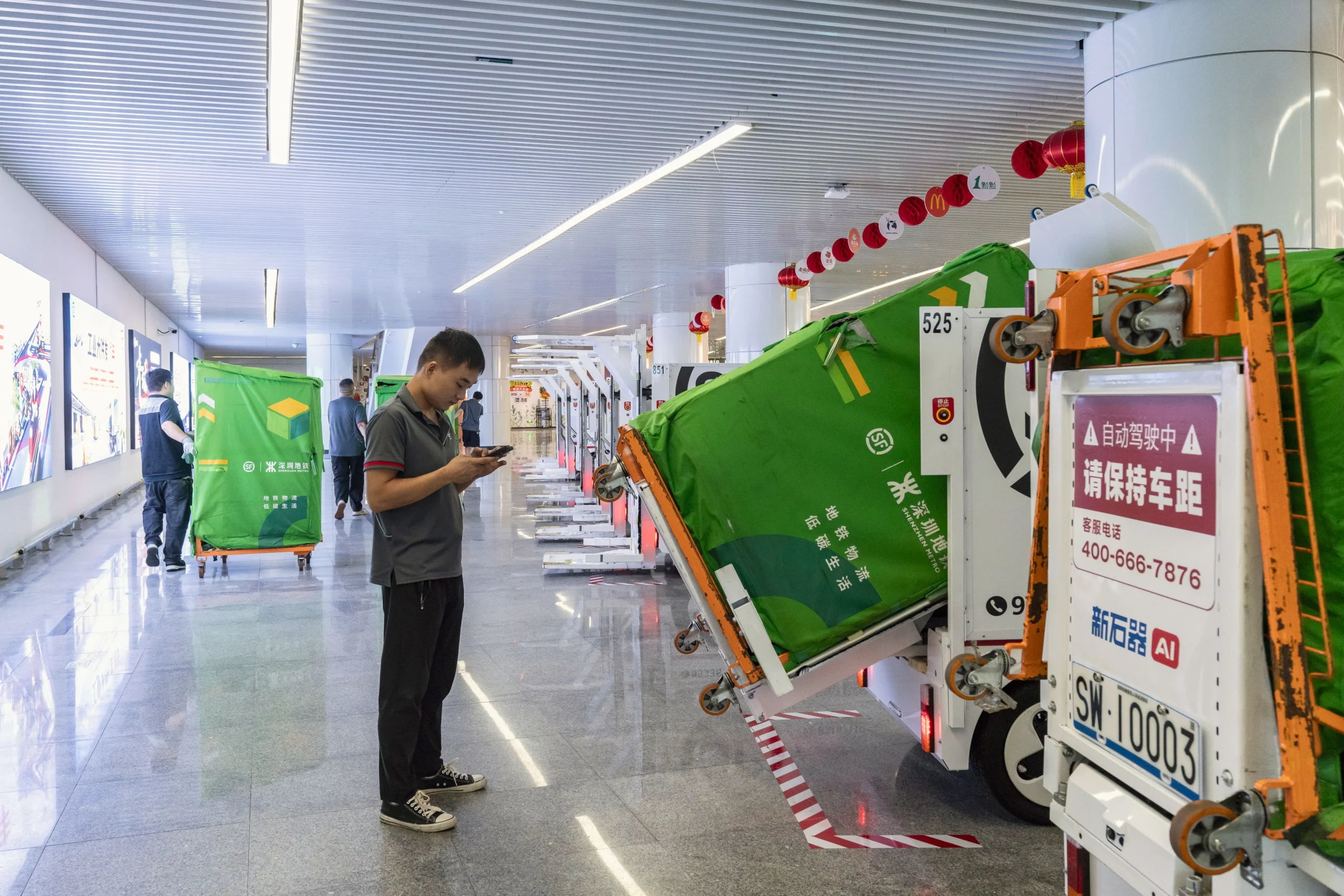 Self-driving taxis collect passengers from the roadside, drones carry parcels, and delivery