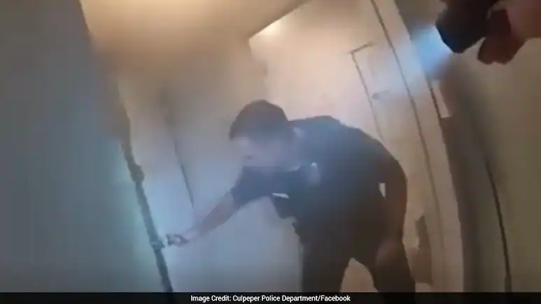 Four police officers rescued an unconscious man from a burning house in Culpeper, Virginia