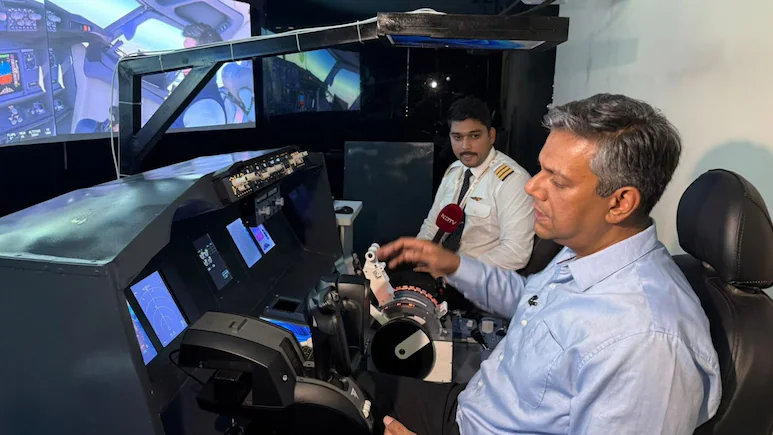 While at 34,000 feet, the co-pilot would have pushed down his control column after which