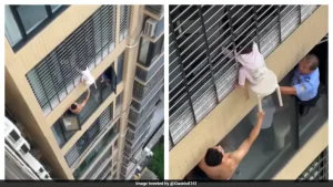 With the girl hanging several floors above the ground, two men in the apartment below leaned