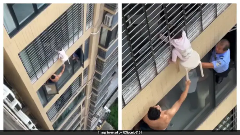 With the girl hanging several floors above the ground, two men in the apartment below leaned