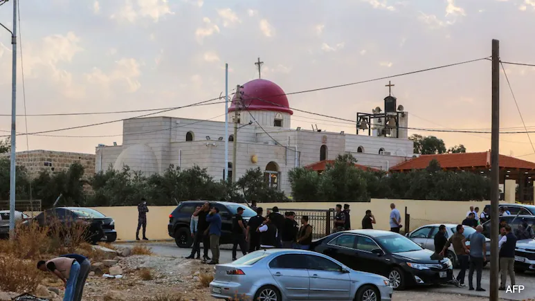 Gunmen opened fire during a funeral at a church in Jordan on Friday, killing seven people